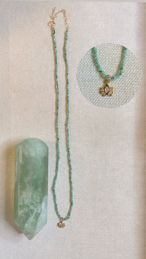 One-of-a-kind emerald necklace with 14k gold lotus charm for Vedic astrology jewelry